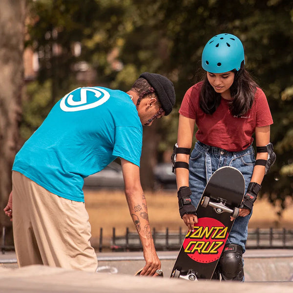 Private skateboard lesson in London with skate instructor teaching beginner skateboarder at skatepark